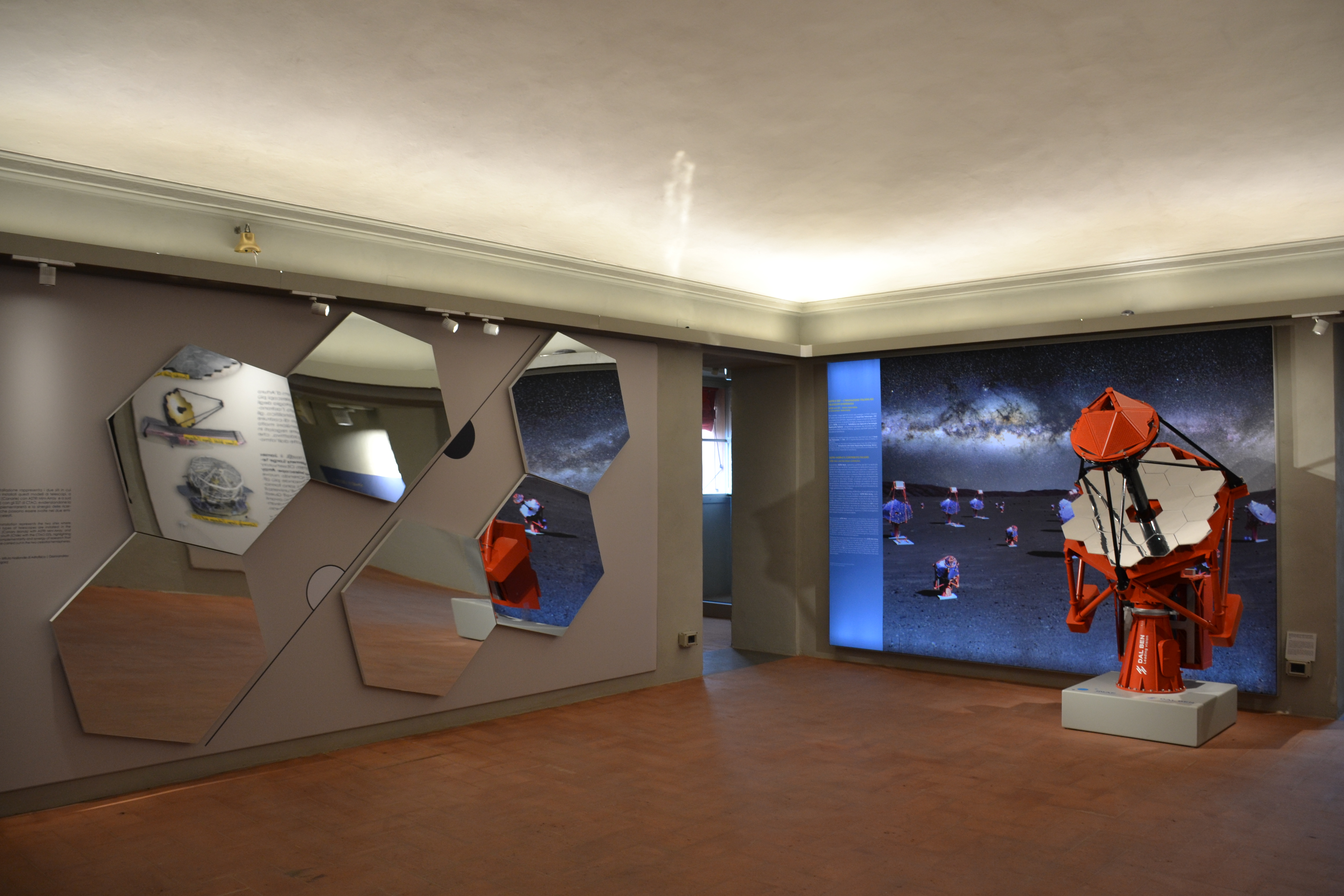The ASTRI mirrors, manufactured by Media Lario, and the 1:4 scale model of the ASTRI Mini-Array telescope, built by Dal Ben, are on display at the Bologna Specola.